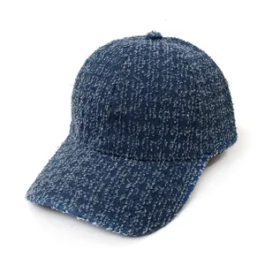 Detailed view of the retro washed denim baseball cap, showcasing textured fabric and curved brim.