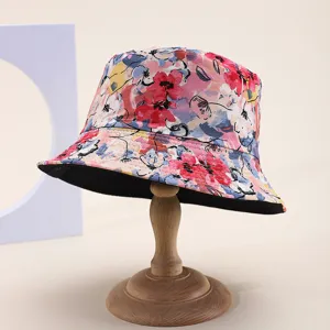 Detailed view of a multi-color floral print reversible bucket hat for sun protection