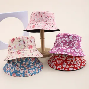 Detailed studio shot of floral print bucket hats in various colors for summer.