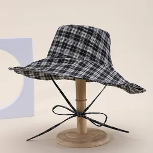 Black and white plaid wide-brim bucket hat, fashionable sun protection hat for women daily wear.