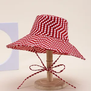 Red polka dot bucket hat for women wide brim sun protection foldable beach travel sun hat.