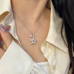 Elegant silver star pendant necklace with sparkling micro-pave zircons and pink stone