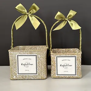Square hand-woven straw gift basket with sage green satin bow