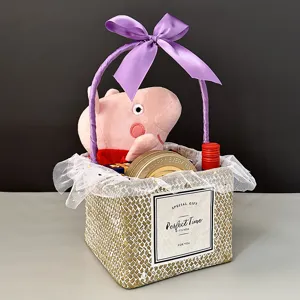 Close-up detail of a handmade square woven straw gift basket with a purple ribbon bow and lace