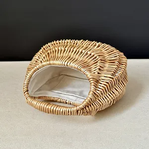 Wicker rattan woven handbag detail, retro moon-shaped straw basket bag with inner lining.