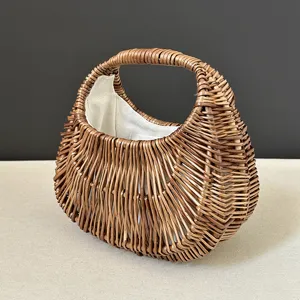 Detailed view of the wicker woven handbag, showing exquisite handmade texture and fabric lining.