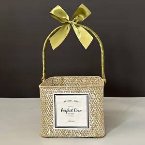 Elegant handmade square woven gift basket with olive green bow and decorative text label