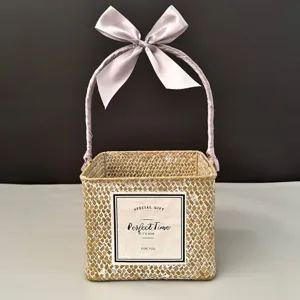Woven square gift basket with lavender ribbon handle and decorative label for weddings