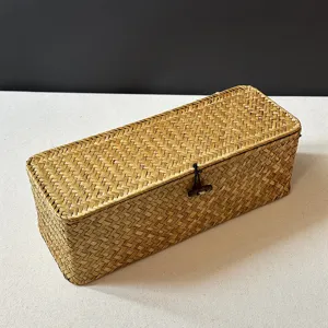 Detailed view of handwoven seagrass storage box with traditional lid and toggle