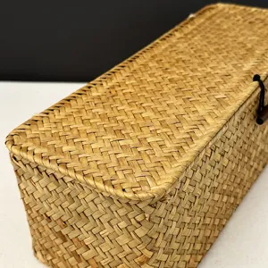 Close-up detail of handmade seagrass woven storage box with toggle closure