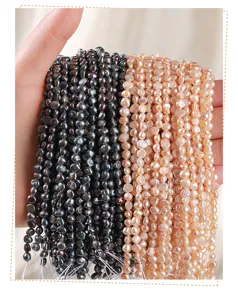 Detailed view of natural pink and black freshwater pearls with high mirror luster