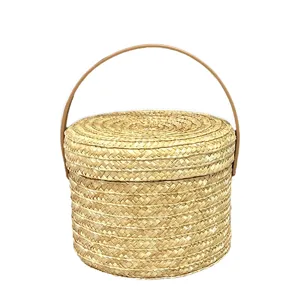 Cesta de regalo de paja tejida a mano con tapa y asa para embalaje ecológico
