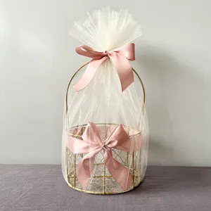 Gold wire gift basket with white tulle and pink ribbon for weddings and Mother's Day.
