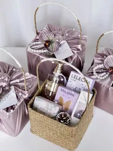 Detailed view of luxury wedding bridesmaid gift baskets with satin wrap and elegant packaging.