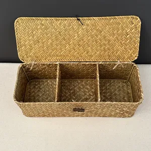 Close-up detail of a traditional handmade seagrass woven box with three compartments