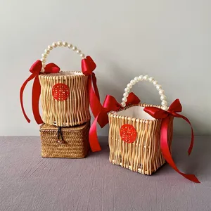 Handcrafted willow wedding gift baskets with pearl handles and decorative red bows
