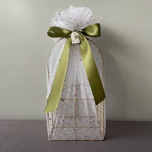 Gold wire gift basket with white starry tulle, olive green ribbon bow for wedding and events