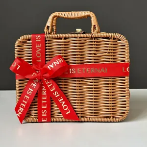 Handcrafted woven bamboo gift basket with red Love Is Eternal ribbon and gold clasp detail