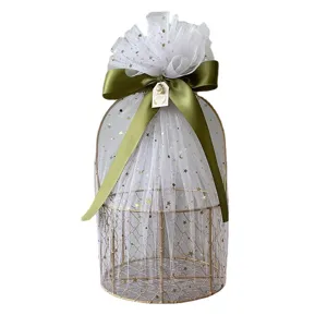 Gold metal gift basket with white star tulle and olive green ribbon for weddings and parties.
