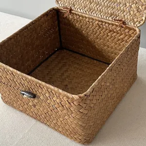 Detailed view of a handmade woven seagrass gift box with lid and wooden toggles