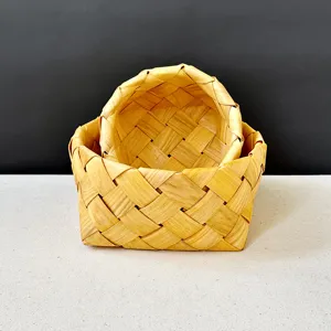 Close-up of hand-woven wooden basket showing natural texture and intricate weave pattern
