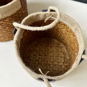 Handmade seagrass woven storage basket with handles for rustic home organization.