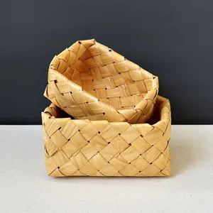 Detailed macro view showing the natural texture of handmade woven wooden storage baskets