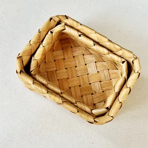 Detailed view of handwoven wooden storage baskets showing intricate braided texture.