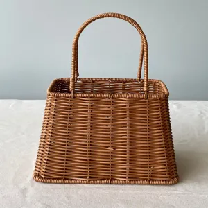 Detailed view of a handcrafted brown rattan woven gift basket with a sturdy handle