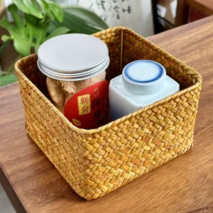Hand-woven straw storage basket for desktop organization, square rattan sundries container.