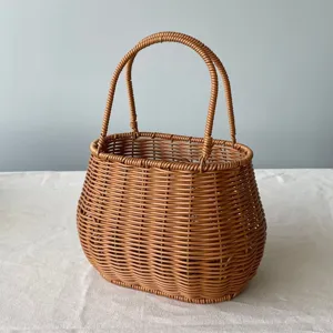 Woven plastic basket detail, imitation rattan flower basket for flower arrangement and storage.