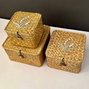 Handwoven rattan gift boxes with embroidered lily of the valley and wooden toggles