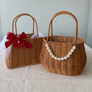 Handmade woven rattan gift baskets with decorative pearls and red bow accents