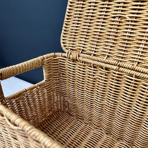 Detail view of the woven storage basket with lid, showing fine texture and sturdy interior.