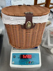 Detailed view of the faux rattan storage basket with lid and liner, showing weight.