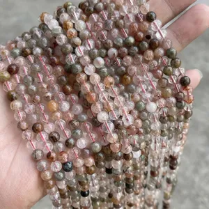 Macro view of 6mm natural rainbow rutilated quartz beads for DIY jewelry making