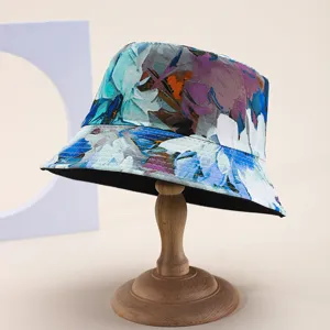 Abstract art print reversible bucket hat on a wooden stand for summer sun protection