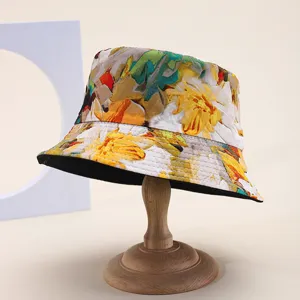 Macro view of colorful floral print bucket hat displayed on a professional wooden hat stand