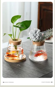 Detail of transparent hammered glass vases for hydroponic plants with cork stoppers.