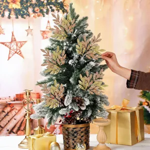 Christmas tree detail view with glitter gold leaves and festive holiday decoration setup.
