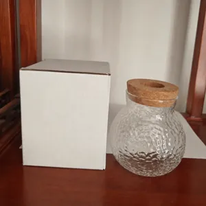 Vaso in vetro trasparente martellato con coperchio in legno per piante da scrivania.