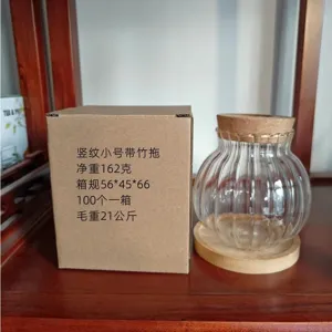 Vaso idroponico in vetro trasparente con coperchio in legno per piante da interno.