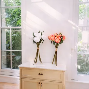 Detailed view of realistic 9-head artificial peony flower bouquets on an elegant cabinet