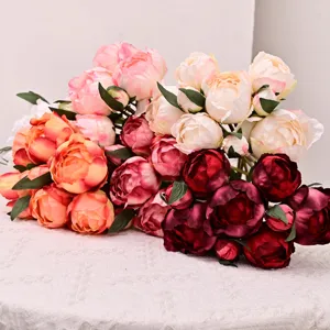 Realistic 9-head artificial peony bouquets in vibrant pink, white, and burgundy colors