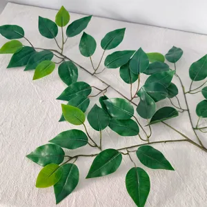 Close-up detail of realistic artificial green banyan leaves with natural texture