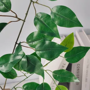 Close-up view showing the natural vein texture and green finish of artificial banyan leaves