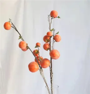 Frosted artificial persimmon branches for indoor home decor and autumn landscaping.