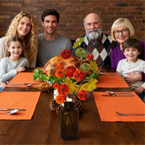 Close-up of harvest festival centerpiece with velvet pumpkins and maple leaves