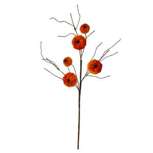 Detail view of artificial pumpkin branch with five small orange velvet pumpkins