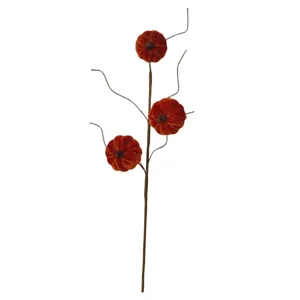 Decorative autumn harvest branch with three orange velvet pumpkins for Halloween table decor